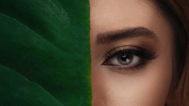 asian girl eye with a leaf