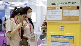 two women testing products at incos asia